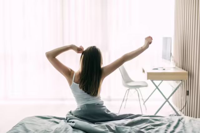 1bce65d7585f84675dd033b9dcc1c86b_back-view-young-woman-stretching-unmade-bed-after-waking-up-looking-city-view-window_231208-11309.jpg